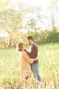 A September backyard anniversary session in Woodsboro MD. A couple shares an emotional moment under the glowing sun