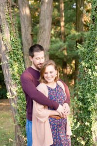A September backyard anniversary session in Woodsboro MD. A couple stands in a loving embrace