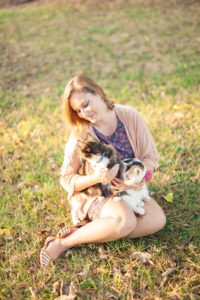 A September backyard anniversary session in Woodsboro MD. A girl cuddles with her cats