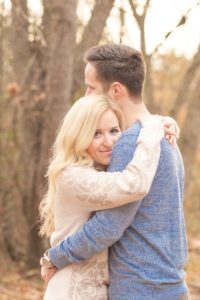 Cozy Autumn Engagement Session at Rockburn Branch Park in Elkridge, MD. A loving couple stands in sweet embrace