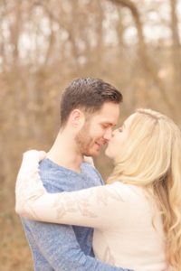 Cozy Autumn Engagement Session at Rockburn Branch Park in Elkridge, MD. A girlfriend kisses her fiances nose lovingly