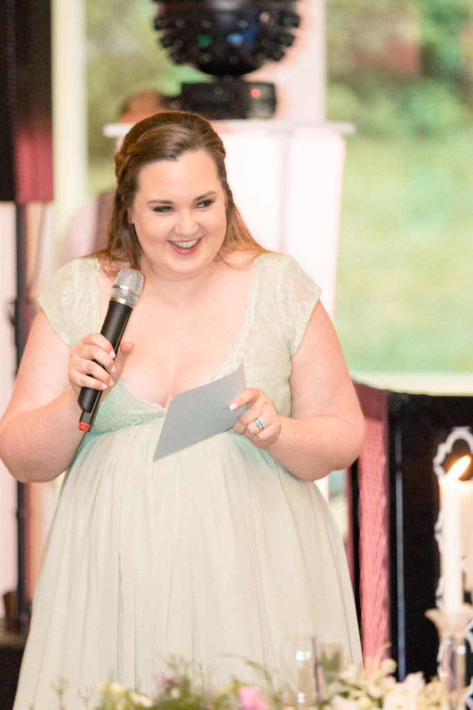 Maid of honor gives her toast for a summer garden wedding reception in Airlie in Warrenton Virginia