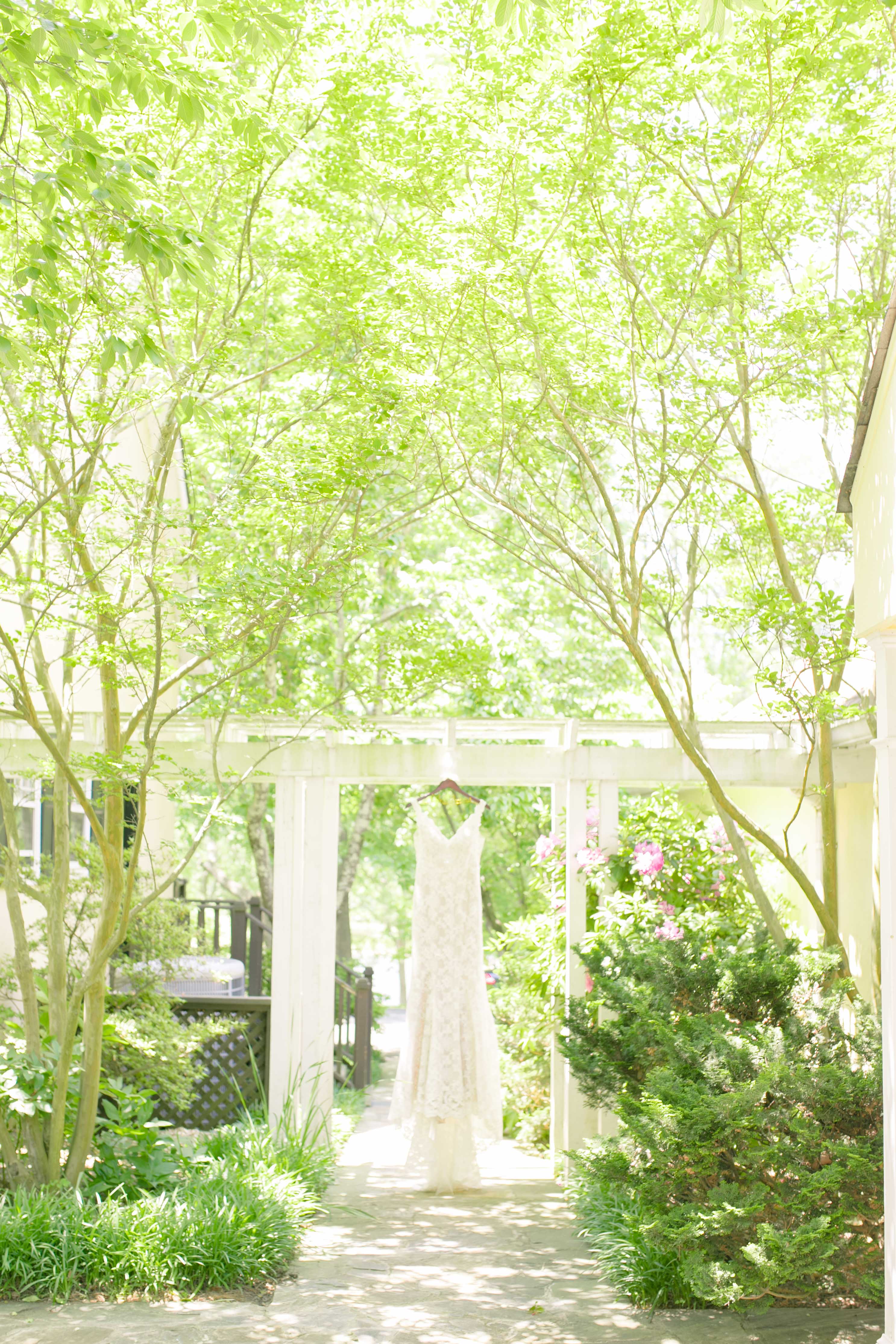 Wedding Dress Detail shot in a summer garden wedding in Airlie Virginia