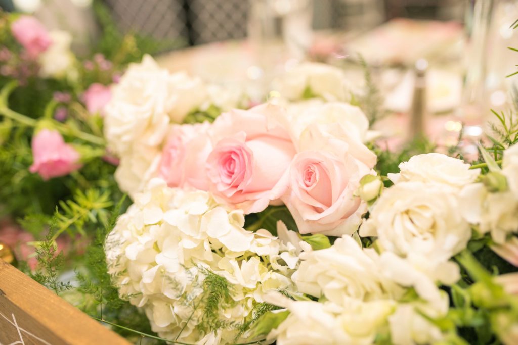 reception floral details of the sweetheart table in a summer garden wedding Airlie in Warrenton Virginia