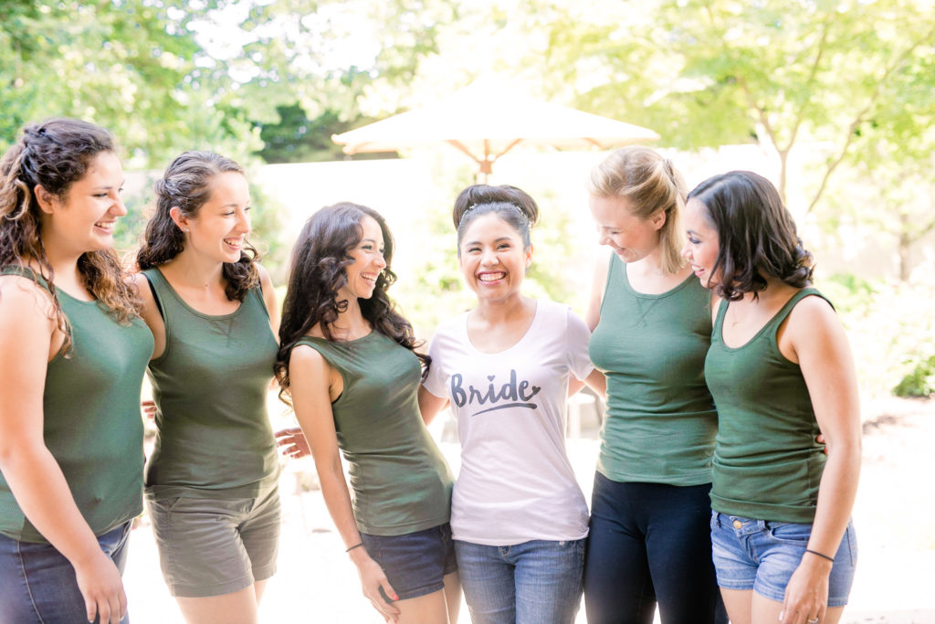 Summer Frederick Maryland Wedding Getting ready with the bride with emerald green Bridesmaid tanks