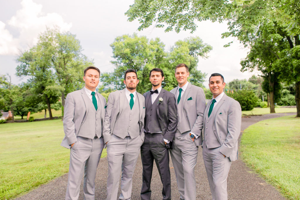 Groomsmen Portraits with emerald green ties in a summer Frederick Maryland Wedding at Prospect Hall Mansion 
