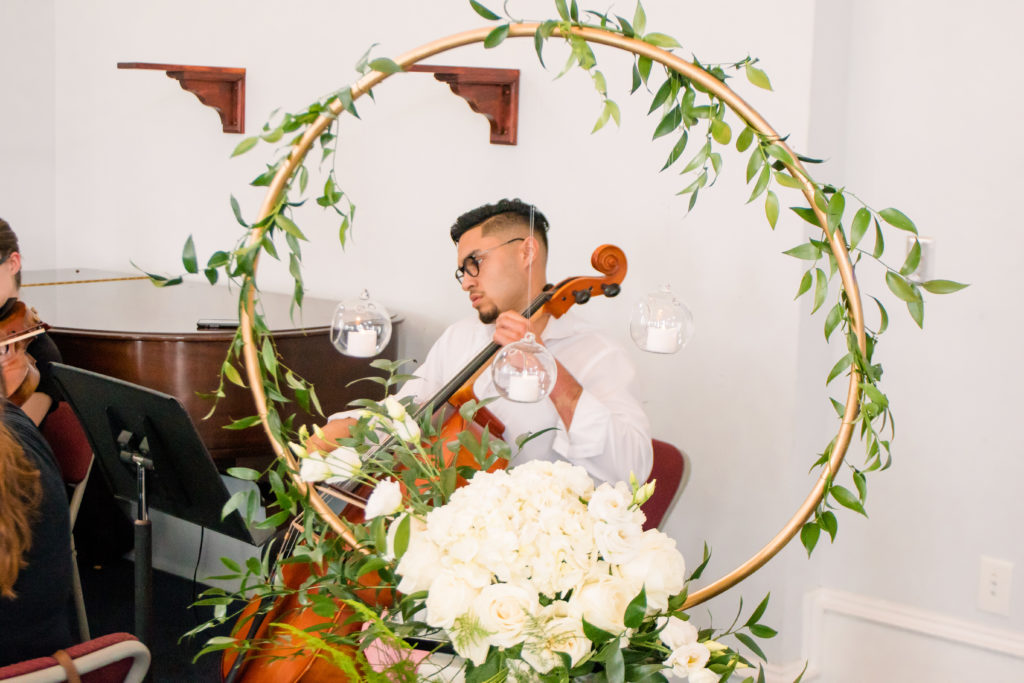A violinist as ceremony details for a summer frederick maryland wedding at the Seventh Day Adventist Church
