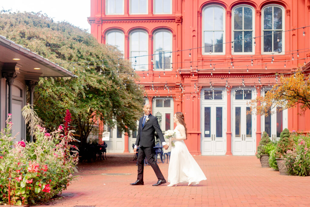 A bride and groom walk around the estate of 1840's Plaza with Maryland Wedding Photographer