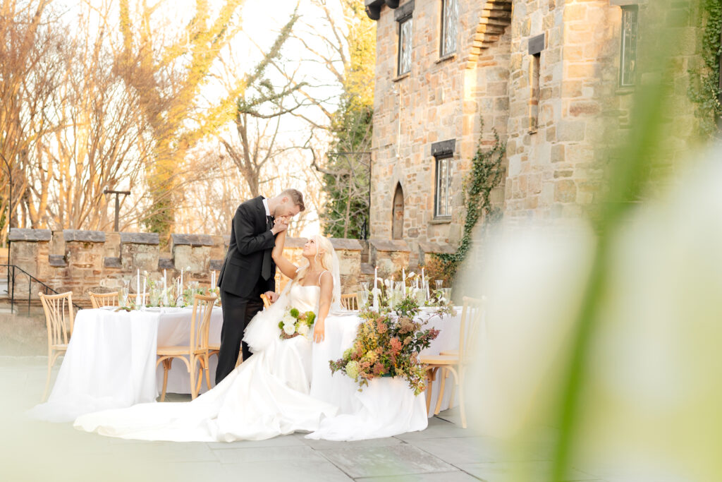 A sweet moment between a bride and groom at the Cloisters Castle is photographed by Maryland Wedding Photographer