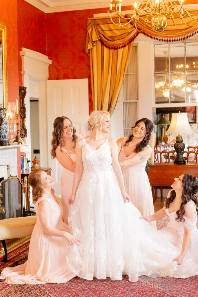 A bride and her bridesmaids get ready for her cermeony at the Antrim 1844 Hotel with Maryland Wedding Photographer