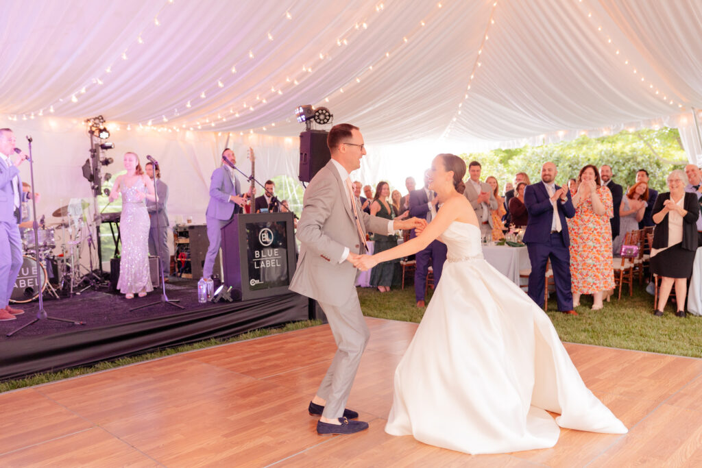 Strong Mansion Wedding Photographer captures a beautiful couples first dance on the grounds under a their tented reception.