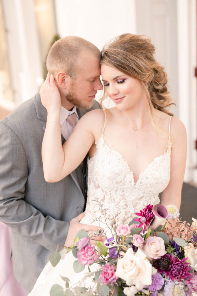 Maryland Wedding Photographer takes a photo of a bride and groom outside the Grey Rock Mansion